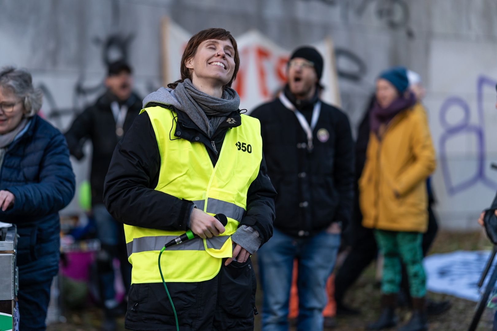 Climate activist in yellow vest at protest event