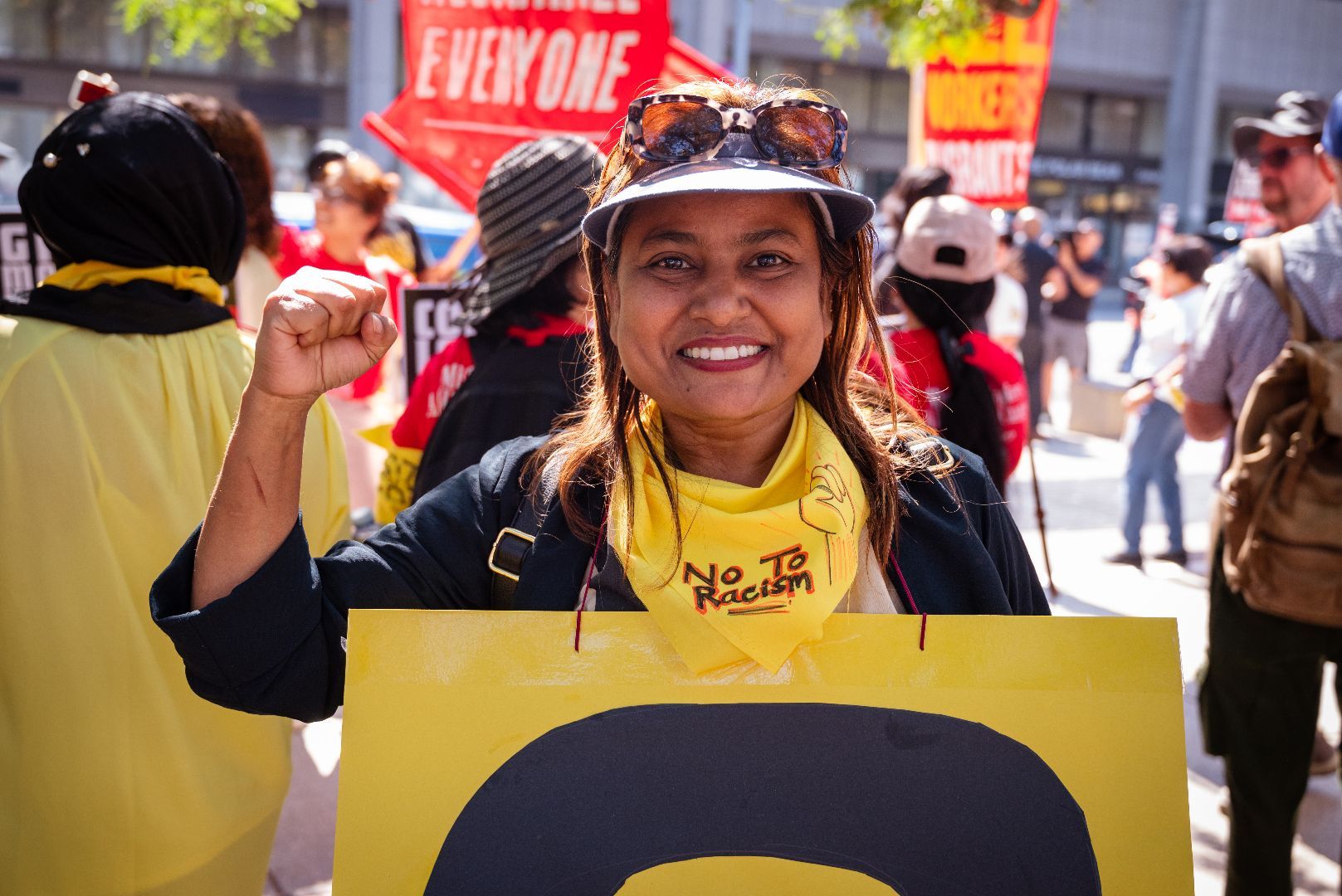 Climate activist in yellow vest at protest event